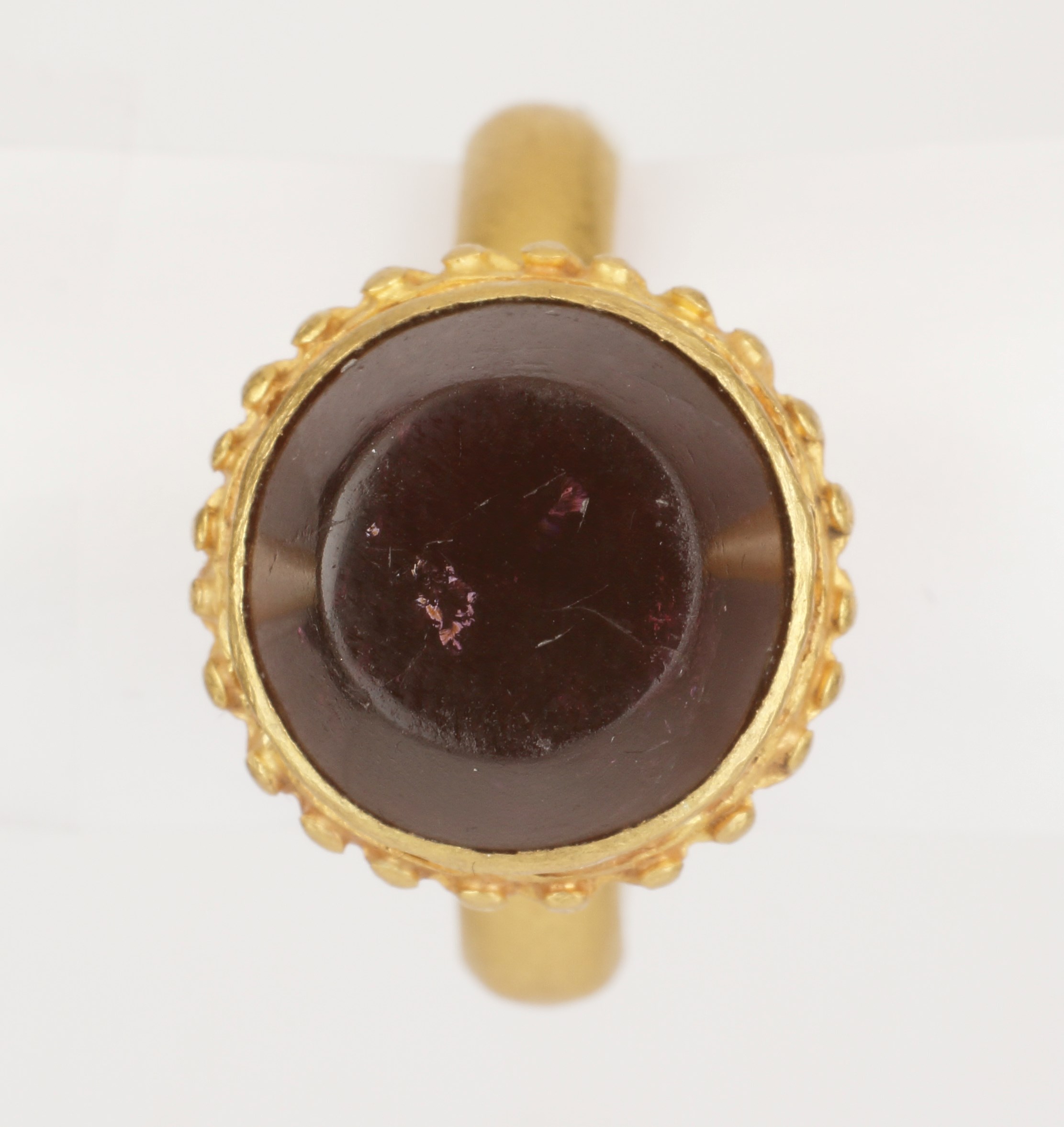 An Early and Rare Byzantine Finger-Ring with High Calyx-Shaped Bezel set with Flat-Topped Conical Garnet